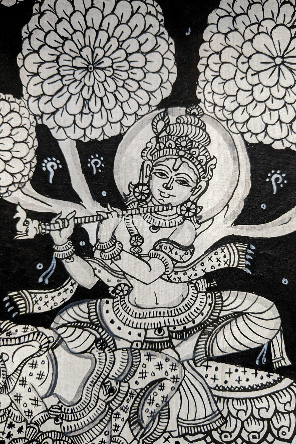 Closer view of Krishna sitting on the elephant playing mesmerizing tune on Flute 