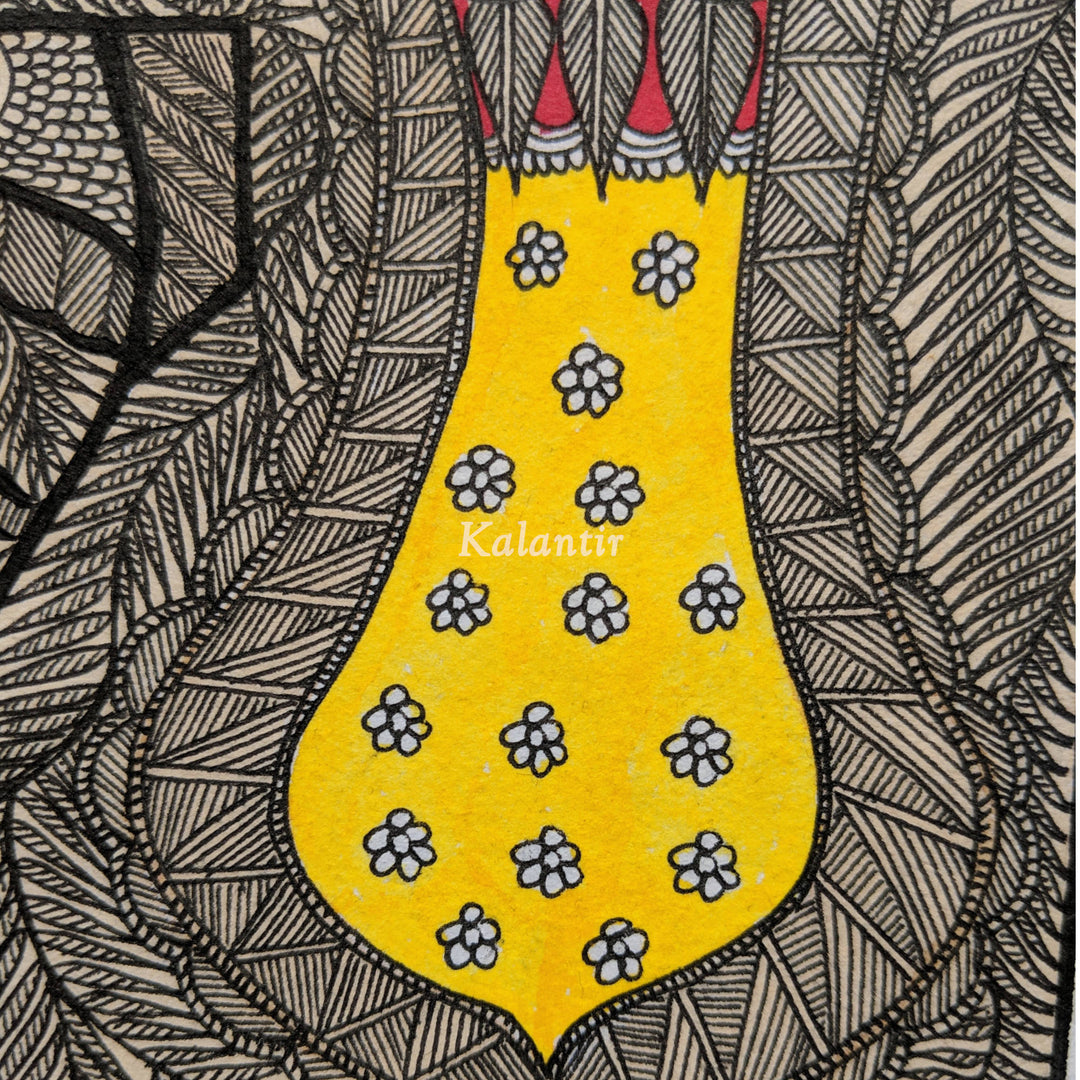 Closer view of black Madhubani flower motif on yellow saddle cloth.
